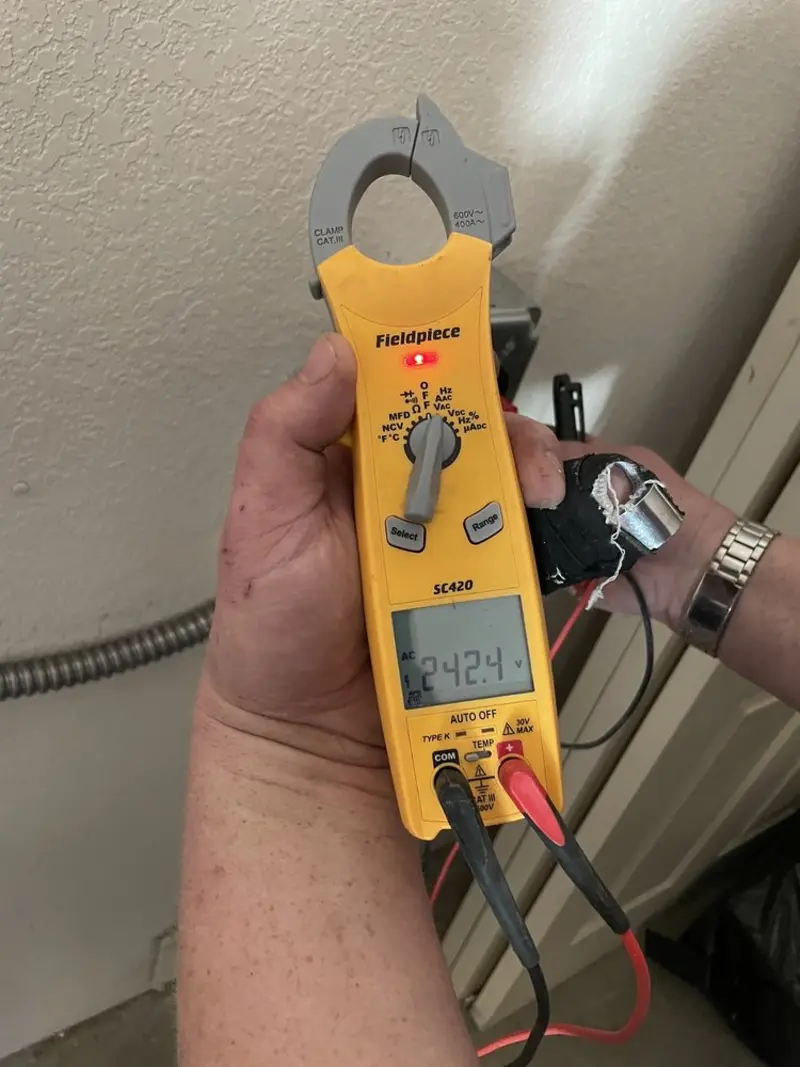 Voltage testing with clamp meter during Circuit Breaker Repair in Trafford